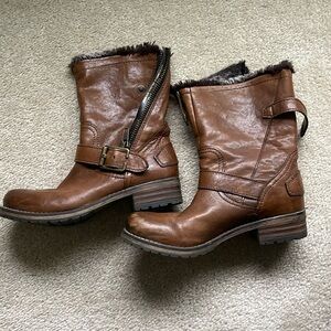Clark’s brown boots.